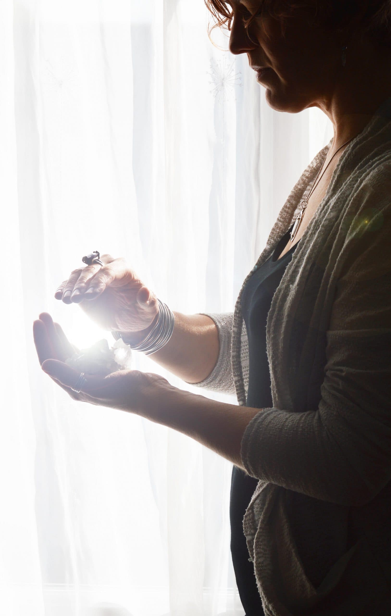 Healing hands cradling light